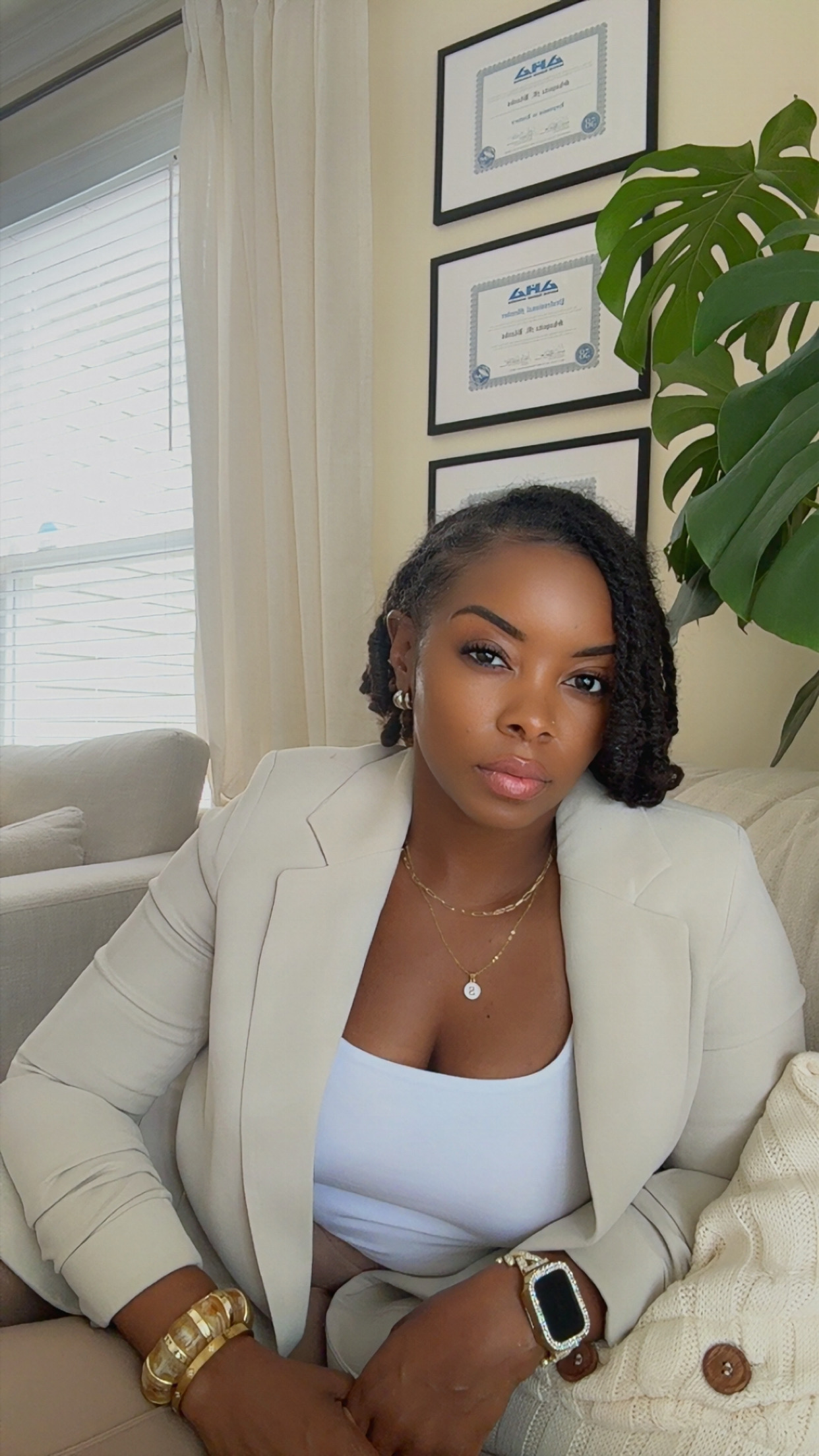 Portrait of Monique Blanks in a cream suit